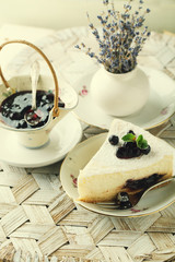 Cheesecake with currant and mint leaf