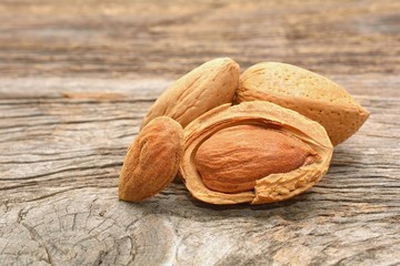 Almond on wooden background