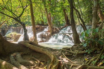 Naklejka na ściany i meble Deep forest waterfall in national park