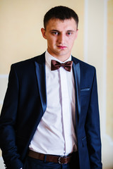 Portrait of groom on bow tie