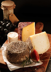 Soft Cheese Coated in Herbs Served on Cheese Board