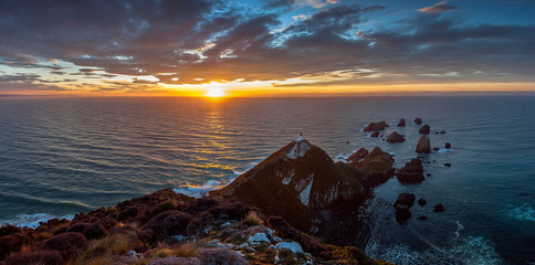 Sunrise at Nugget Point, New Zealand.