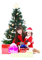 Fototapeta na wymiar Mom and daughter at Christmas tree