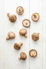 Overhead view of mushrooms on wooden background