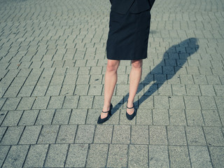 Legs of young woman in the street