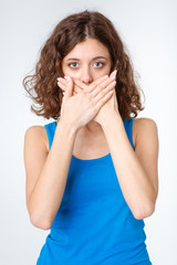 Woman covering her mouth