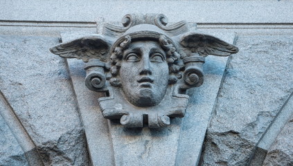 Bas-relief mask of the god of trade of Mercury (Hermes)