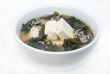 Japanese soup with herbs and cheese on white background