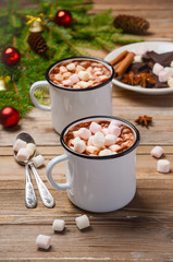 Hot chocolate with marshmallows on the rustic wooden table. Christmas composition.