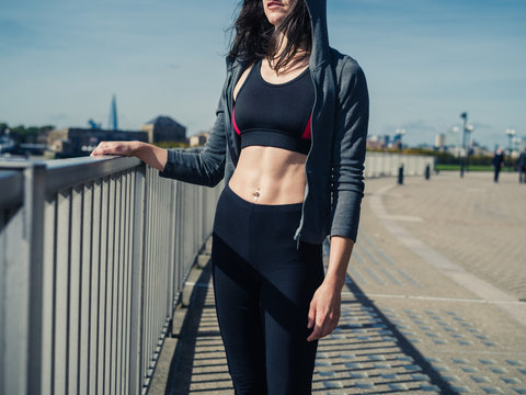 Fit and athletic young woman in city