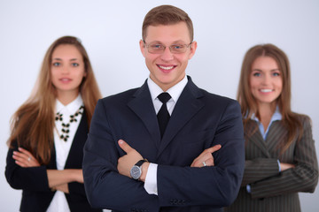 Cheerful business man  with colleagues in the background, start up team