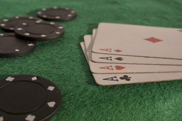 Poker cards and chips on green poker table. High resolution image.