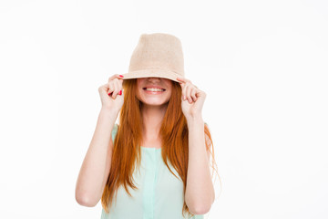 Funny amusing young woman hiding under boonie hat