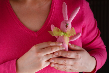 Female in pink give soft toy