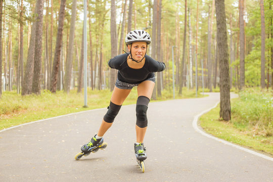 Active woman on roller skates training