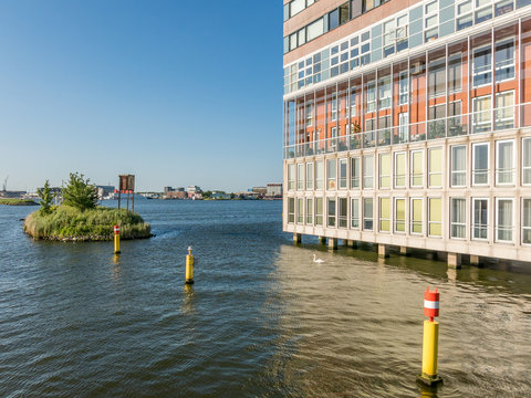 Modern social housing apartment building Silodam alongside IJ canal in Amsterdam, Netherlands