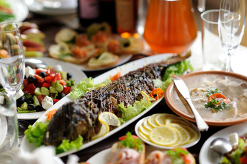 table set service with silverware and glass stemware at restaurant before party