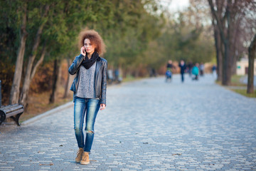Woman walking and talking on the phone