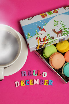 Tag hello december, cup of coffee with macaroons