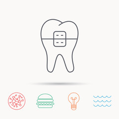 Dental braces icon. Tooth healthcare sign.
