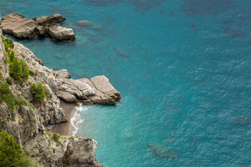 Small cove and turquoise sea on Amalfi coast in Italy