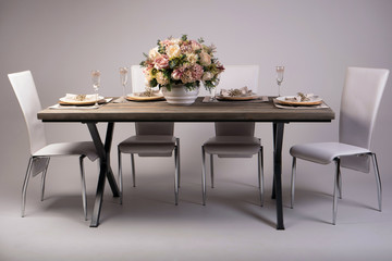 Wooden table setting and decoration for meal time, studio shot