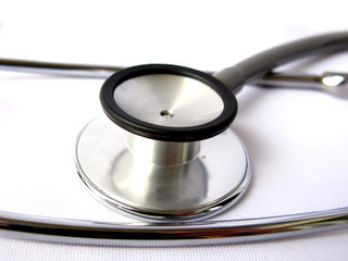 A grey medical stethoscope isolated in white background