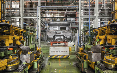 Bankrupt and abandoned automobile plant. The frame of the cab ca