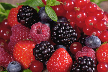 Fresh berries with mint leaves