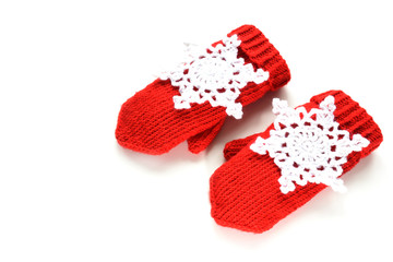 Red knitted mittens with decoration