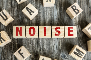 Wooden Blocks with the text: Noise