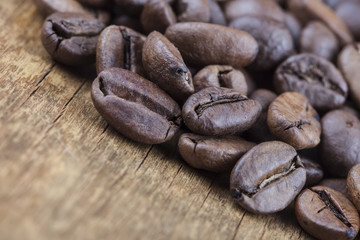 coffee grains on grunge wooden  closeup background