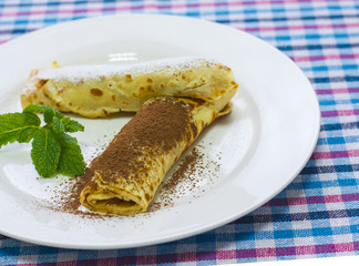 Bliny sprinkled of grate chocolate