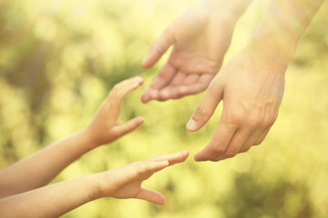 Father and daughter hands outdoors