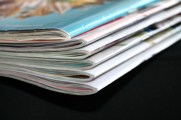 Magazines on the black sofa