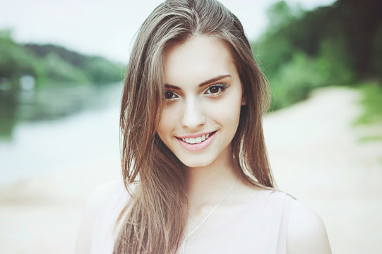 Beautiful smiling girl outdoor portrait