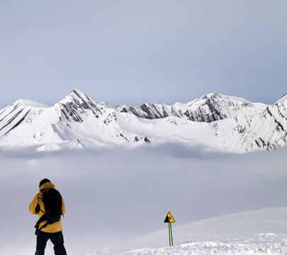 Freerider on off-piste slope in mist