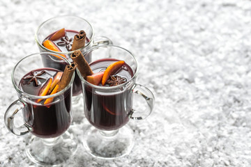 Glasses of mulled wine in snow