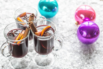 Glasses of mulled wine in snow