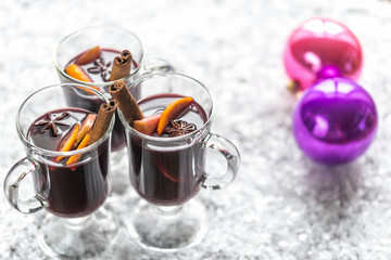 Glasses of mulled wine in snow