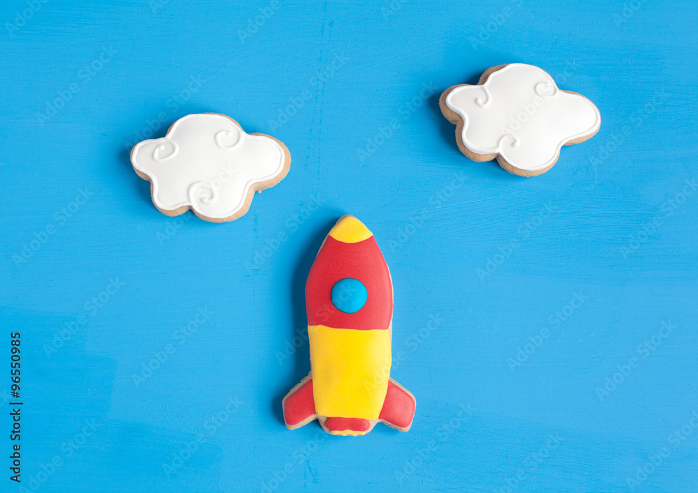 Wall mural homemade gingerbread cookies in the shape of spaceship and clouds