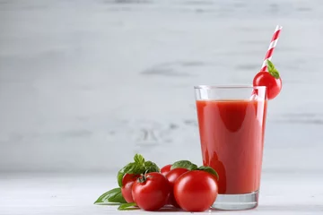 Fototapete Saft Glass of tomato juice with vegetables on wooden background  © Africa Studio
