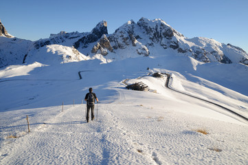 Fototapeta na wymiar Male hiker against winter mountains background