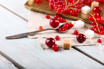 Fototapeta na wymiar Fresh red currants with sugar on table close up