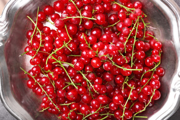 Fresh red currants in bowl close up