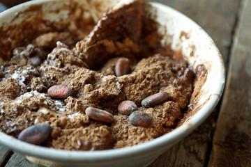 Preparing dough for chocolate pie on table close up