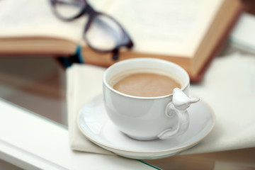 Cup of coffee on table close up