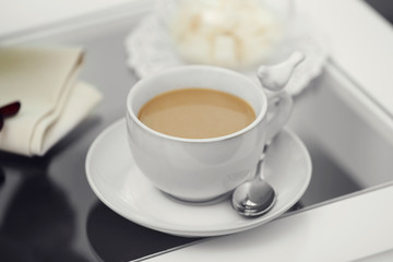 Cup of coffee on table close up