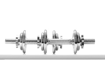 dumbbells over white background