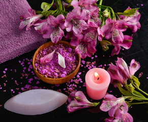 Obraz na płótnie Canvas Spa set and orchid ,candle, salt with spoon in bowl ,towel ,bowl